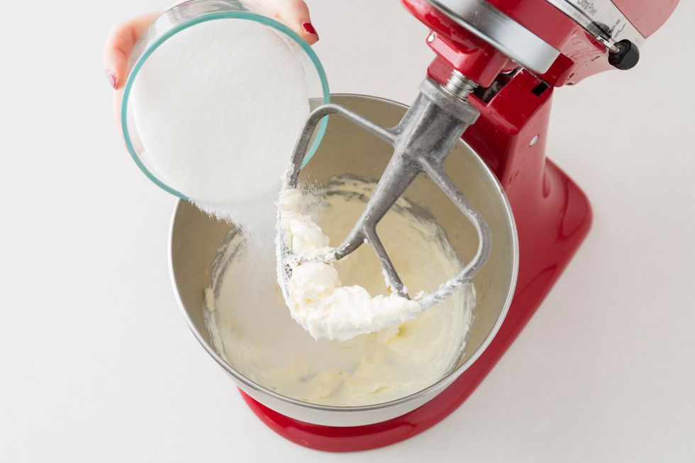 Add 1 cup of granulated sugar. Continue to beat on a medium high speed until fluffy.