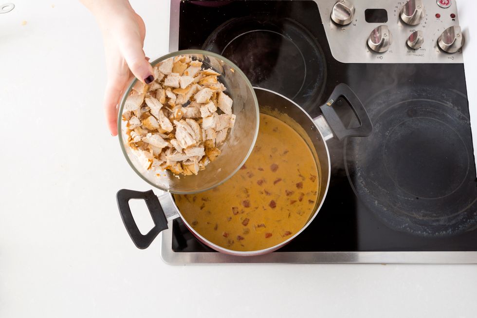 After the chicken has rested for at least five minutes, dice and add to the pot.