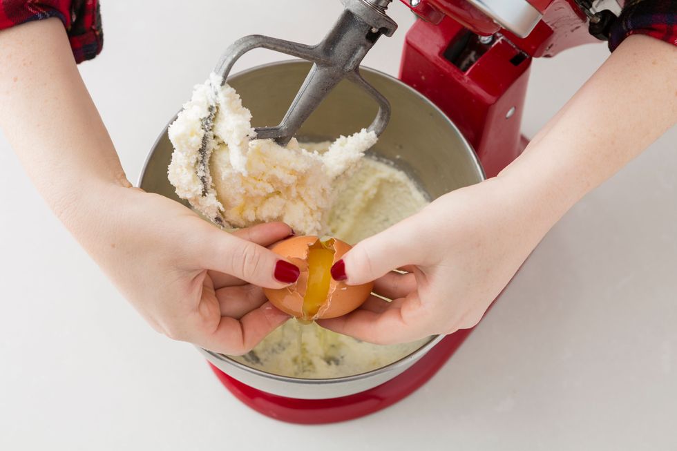 Beat in one large egg, vanilla extract, and pepper extract on high speed.