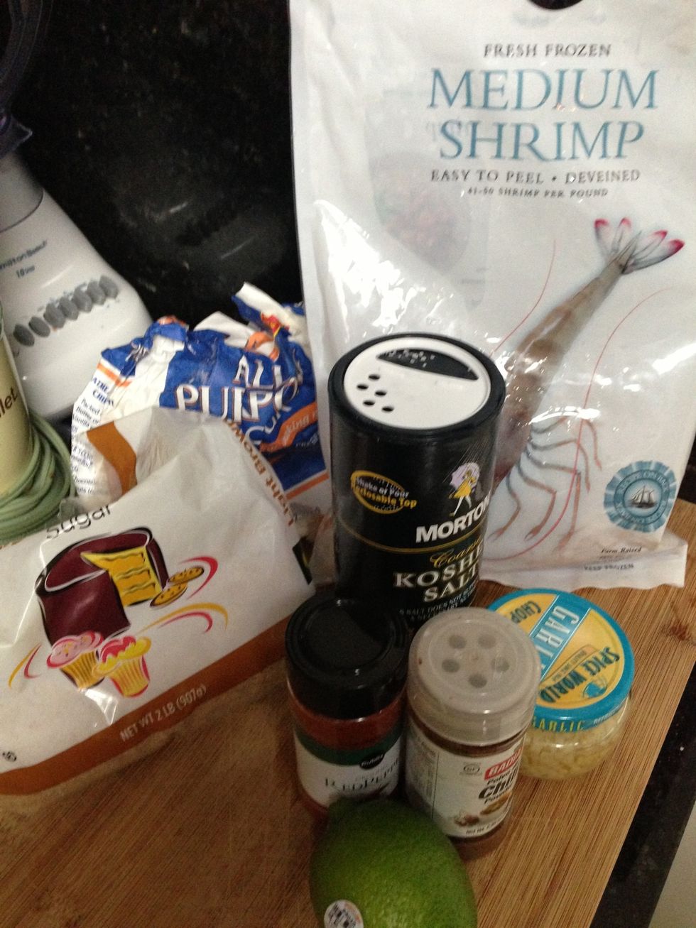 1/2 cup sugar 1 Tbsp. all-purpose flour 1 tsp. kosher (coarse) salt 1 tsp. chili powder 1/8 tsp. ground red pepper (cayenne) 1 clove garlic, finely chopped 1 lb large shrimp peeled w/ tails  1/4 lime