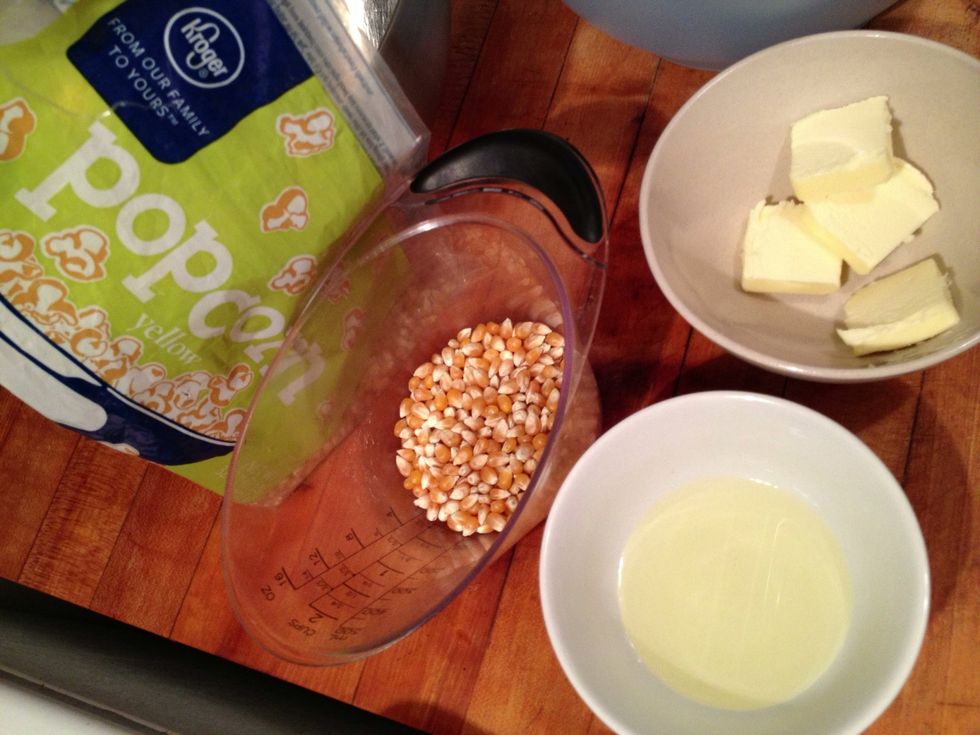 1/3 cup popcorn, 3 tbsp canola oil, 4 tbsp unsalted butter. Set your cast iron pot to medium low heat and allow it to heat up a few minutes.