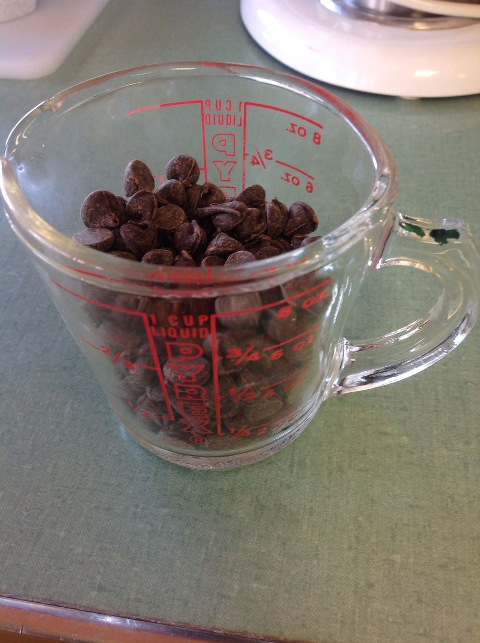 1/4 cup - 1/2 a cup chocolate chips. Melt those in a microwave safe bowl.