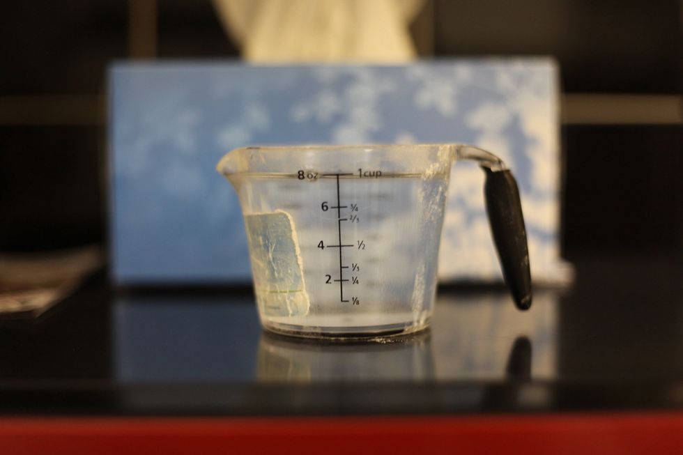 1 and 1/2 cups of warm water. In this case, Warm= more cold than hot or the yeast will do nothing. R.I.P all the yeast I've destroyed trying to work that out.