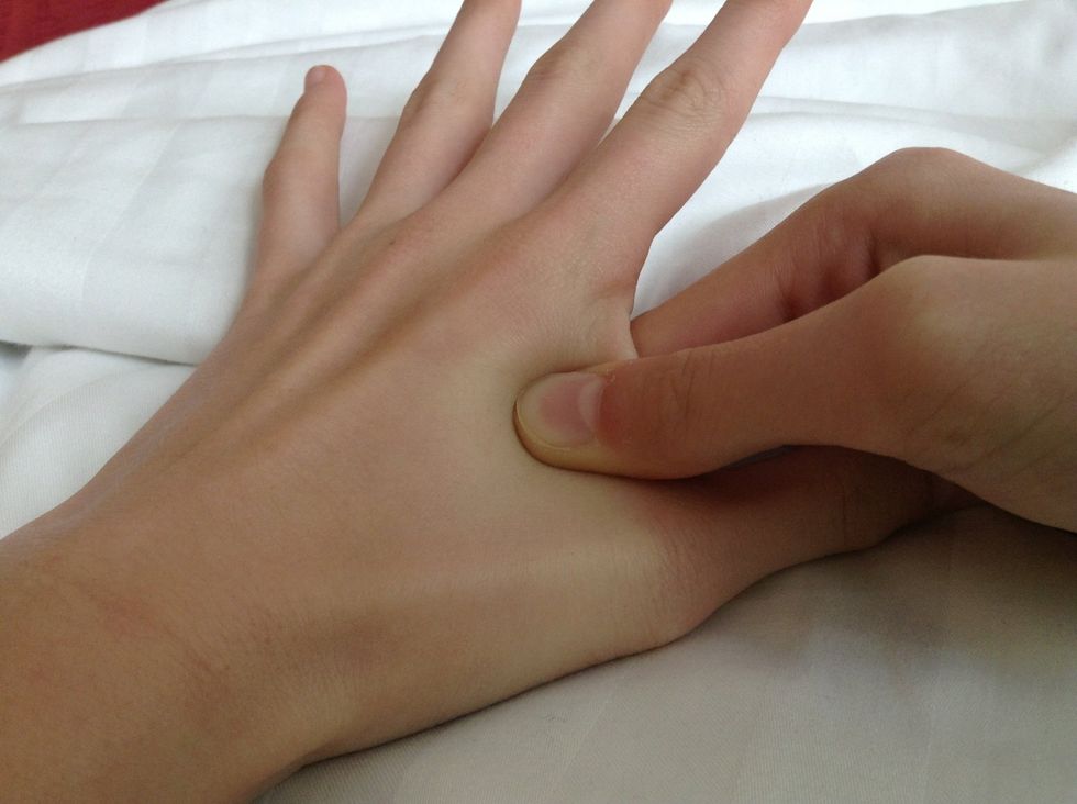 1. Apply pressure to the skin between your index and thumb (area on photo above) using your other thumb. The nerve in that area releases tension from the head, thus reducing the headache.