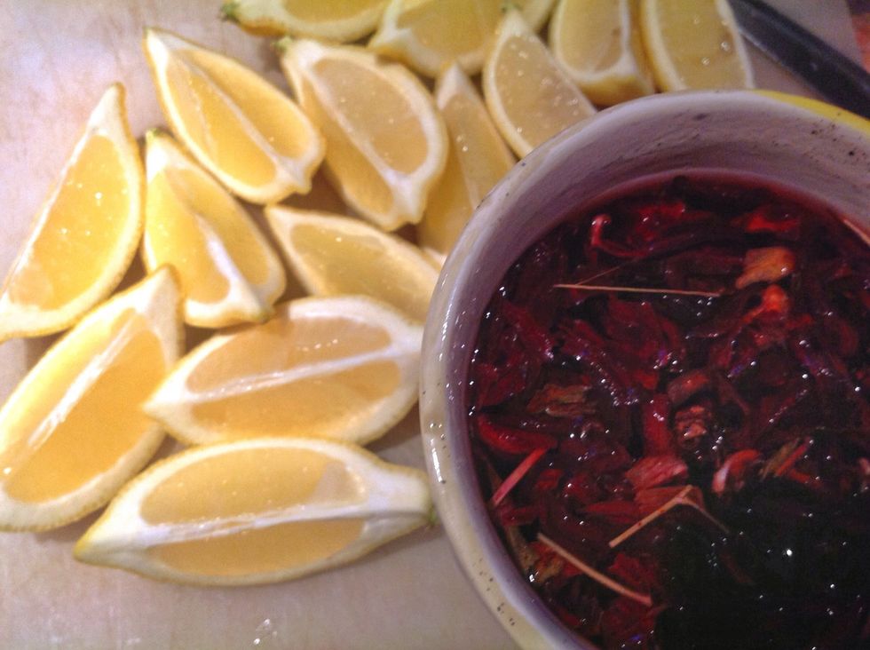 1- cut some lemon , take off the skin . 2- add some boiling water to A handful of hibiscus flower , leave for a 1/2 hour - better to cover it so you could keep the smill - .