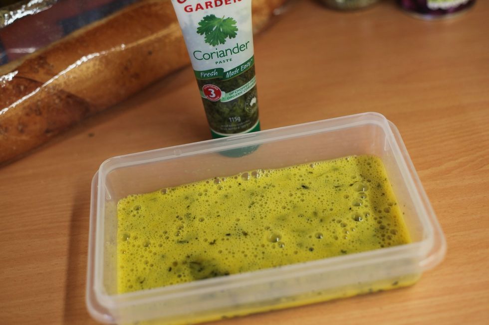 1 egg and 1 tbsp of lazy coriander. If you want to chop fresh coriander that's much better but I'm from the lazy generation. We use this to hold the crumbs onto the chicken.