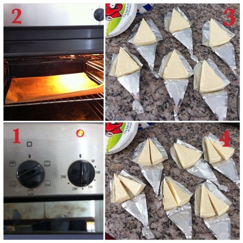 1. Preheat oven (180 degrees); 2. Place baking paper in oven; 3. Open the triangles; 4. Cut cheese into half