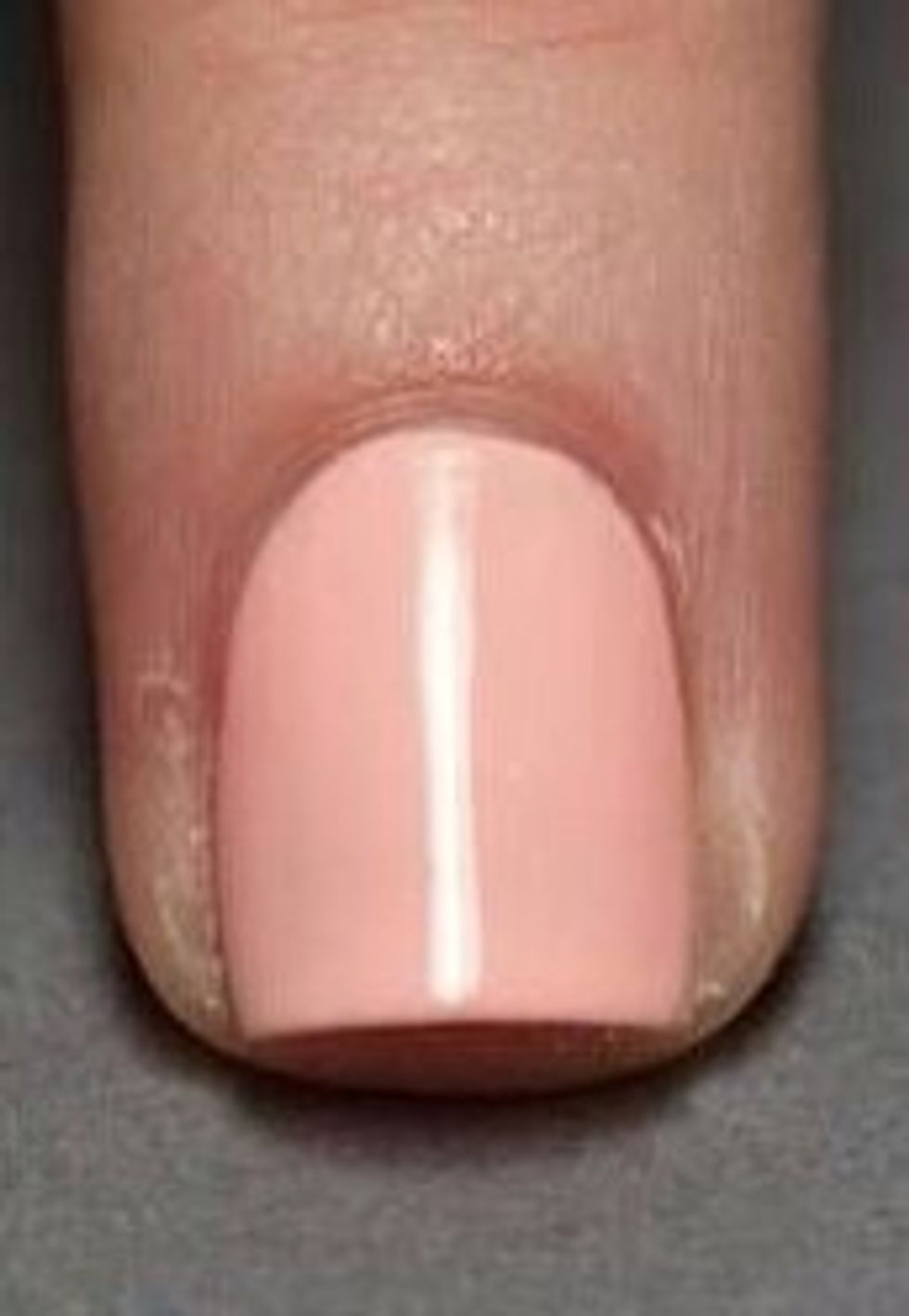 1.Put hand on flat surface and apply a base coat on your fingernails and wait about 20 min for them to dry (note: color may show under your 2 chosen colors, so using a light shade of polish is better)