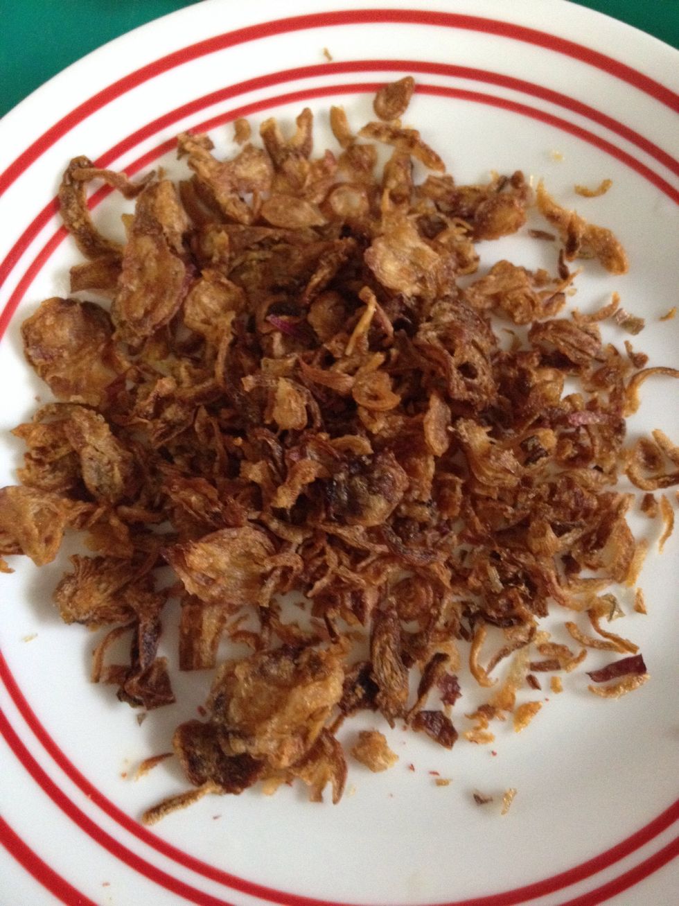 1. Slice the shallot thinly and fry until golden brown 2. Set aside and use as condiment 3. Use the same oil to fry the onions and spices