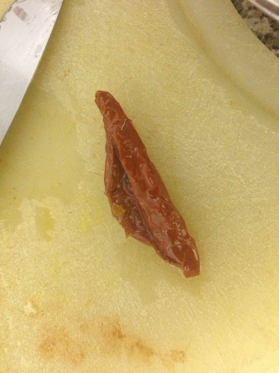 1 sun-dried or oven-dried tomato sliver in olive oil.