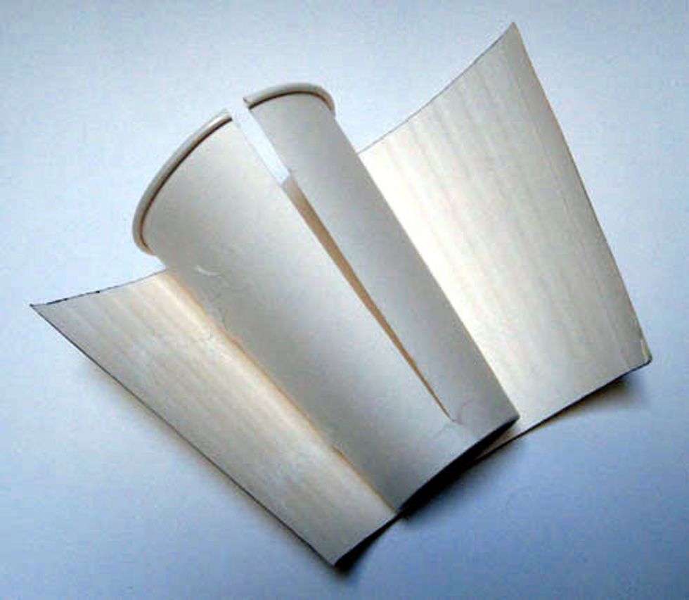 1.\tCut a slit down the side of a 16 oz. paper coffee cup.