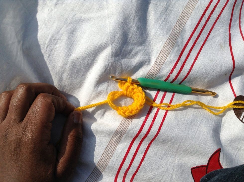 10 hdc in the ring. Pull the tail end of the yarn at the center of the circle to cinch the circle closed.