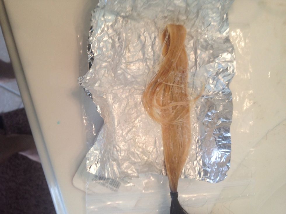 10 minutes later, still not quite there.  I added a bit more of the bleach mixture. I folded back in foil and set aside.