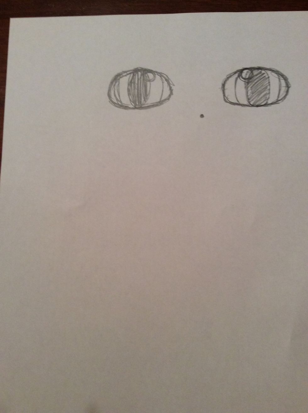 10. To draw the beak, measure 2cm down from the middle of the two eyes and mark with a small \u00a0dot.