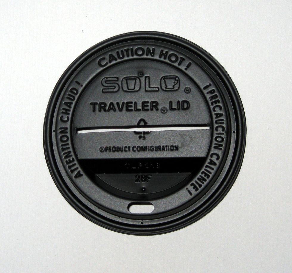 11.\tCut a 1/8\u201d wide slit into the cup lid between the edges of the raised rim.