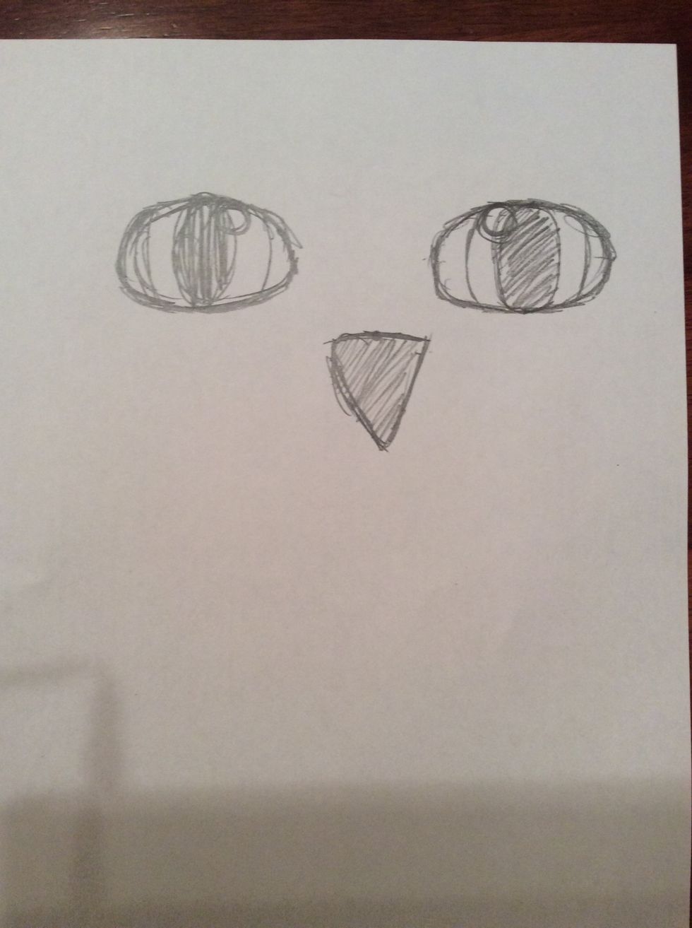 11. Using the marking draw a straight line for the bottom of a triangle, then complete the triangle and shade it lightly with lead pencil.