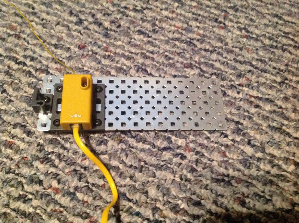 14. Connect the Yellow Receiver to the Flat Chassis Panel. Connect with 4 8-32 1/4" Screws and 4 Keps Nuts. Then, connect the Antenna Base to Flat Chassis Panel with one 8-32 3/4" Screw.