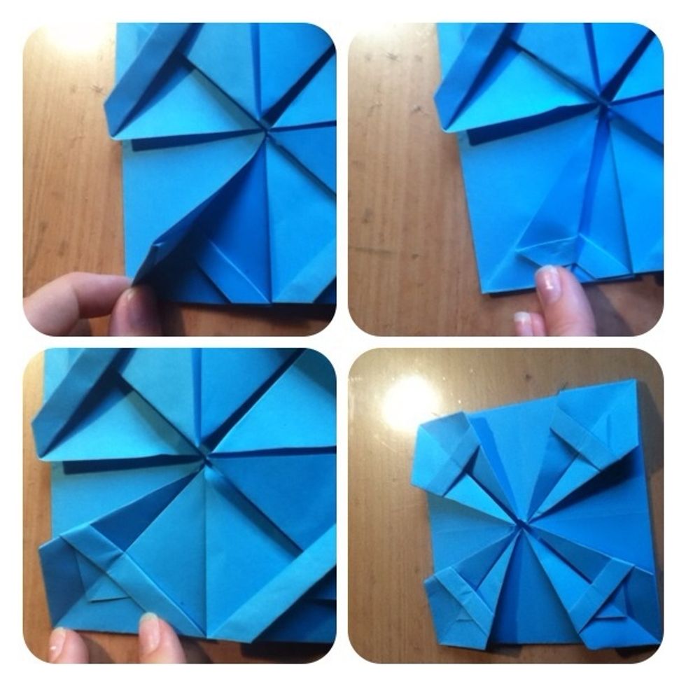 14. Fold one square in half and then fold back the side 15. Fold back to look like photo 16. Repeat on all sides