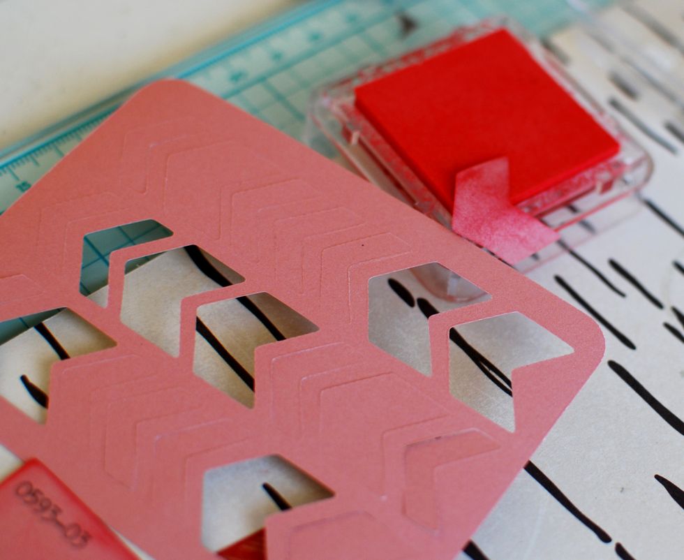 14.\tFind this arrow die cut journaling card and punch 5 arrows from it. Dab them in red ink and let dry.