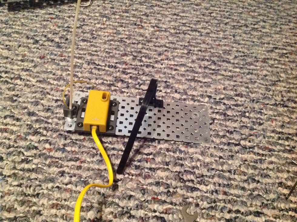 15. Next, carefully slide the antenna through the Antenna Tube and insert into the Antenna Base. Connect the Battery Holder to the Flat Chassis Panel with 2 8-32 1/2" Screws and 2 Keps Nuts.