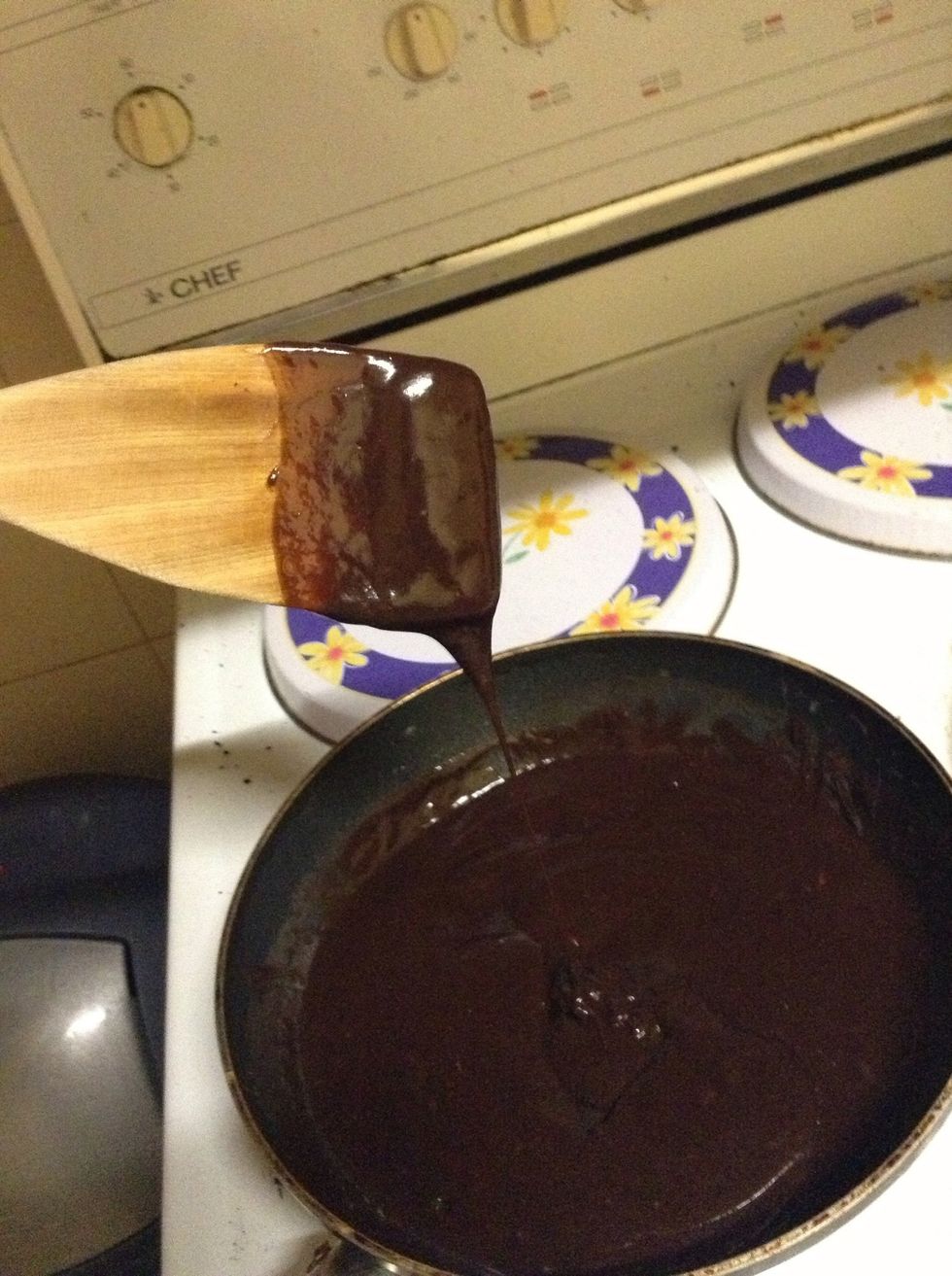 15.) Once the chocolate is almost fully mixed, put the chocolate mixture back onto the heated oven top, and keep mixing until the chocolate is 100% combined, and the left mixture is gooey