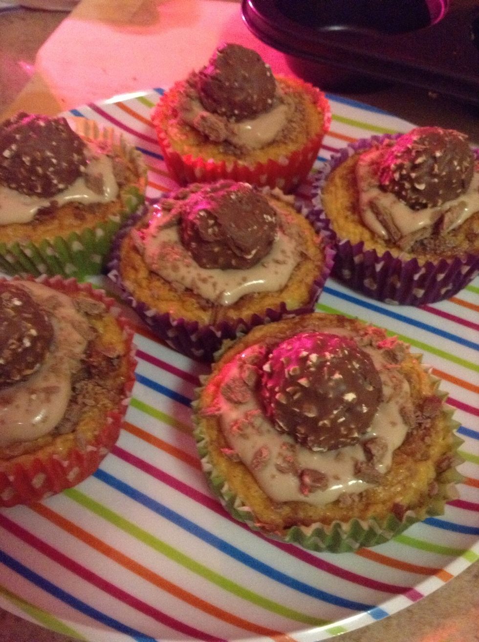 16.) After the chocolates have been added, sprinkle some flake crumbs on the chocolate icing