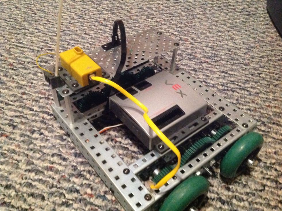 16. Connect the Flat Chassis Panel to the main body with 4 8-32 1/4" Screws inserted through the Flat Chassis Panel into the previously fastened 2" Threaded Beams.
