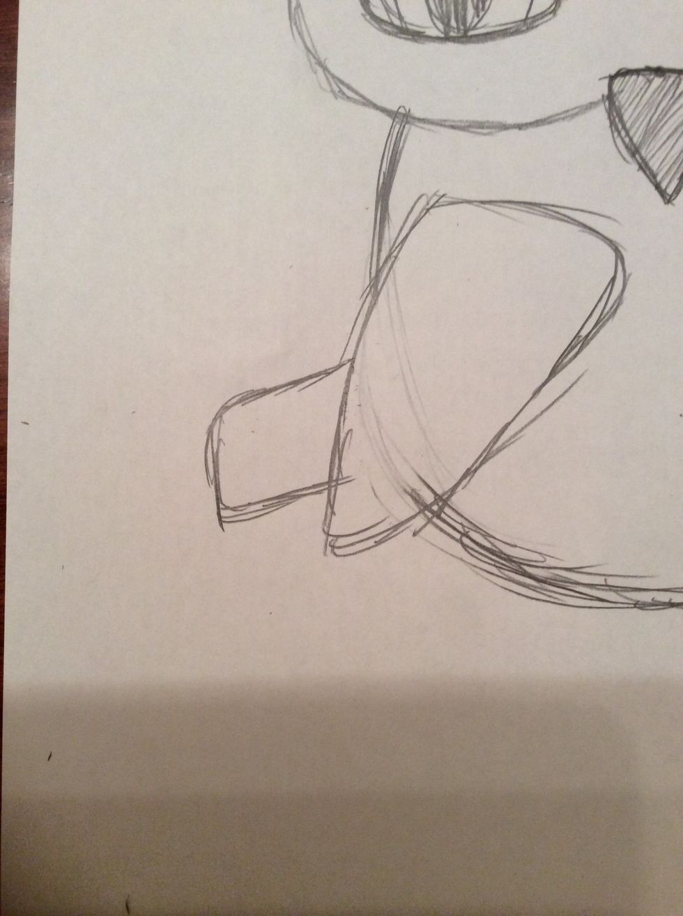 16. For the tail, draw a small rectangle with rounded vertices to the left of the wing and connected to it. Refer to the picture for help.