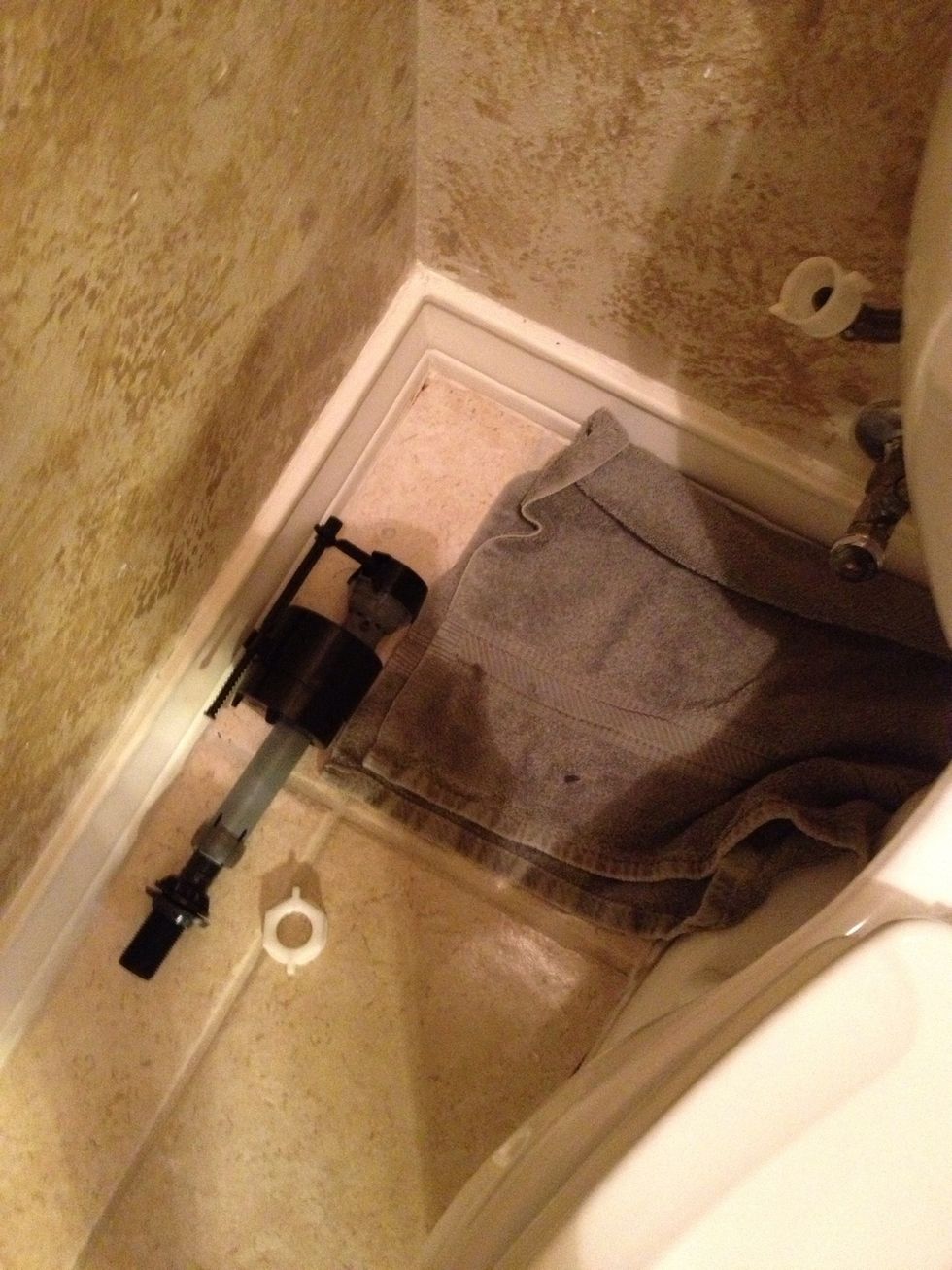 1st turn water off at the wall. You will need towels for excess water from line and tank. 2nd disconnect water from tank. 3rd drain tank(flush and towel the excess).