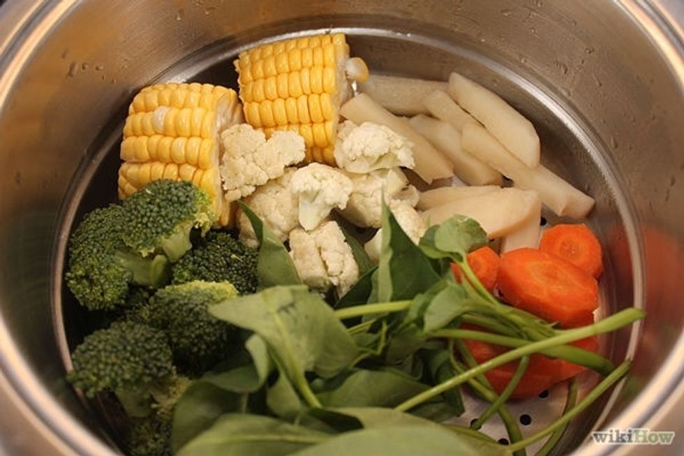 2.Add the vegetables. After the steamer has been covered for a minute. Keep them in separate groups; this will make them easier to remove when they finish, as each one cooks at a different time.