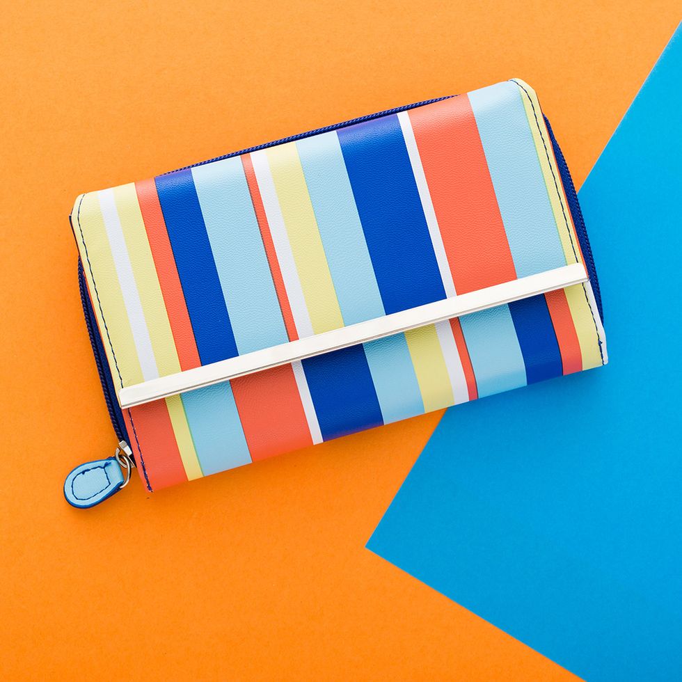 2. Big Fat Bright Stripe Wallet ($24.99): Add a little pep to her purse by gifting her this lively striped wallet. We love the combo of coral and blue on this particular piece.