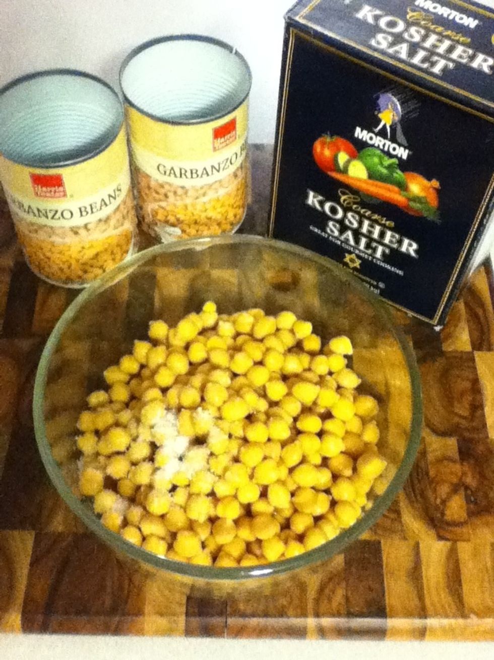 2 cans of garbanzos is a scant 4 cups. You're gonna add a teaspoon of salt, stir, and set aside.