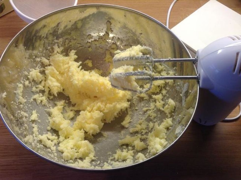 2. Cream the butter and sugar together in a large bowl until light and fluffy. Add the eggs, lemon zest and juice and beat until thoroughly combined. Fold in the flour to form a smooth batter.