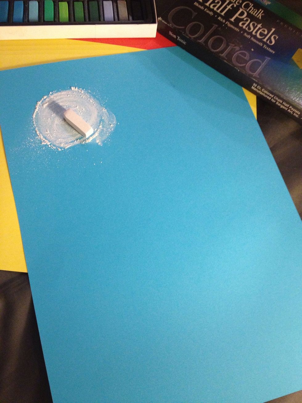 2. Draw a circle at the top of the page with white Albastl