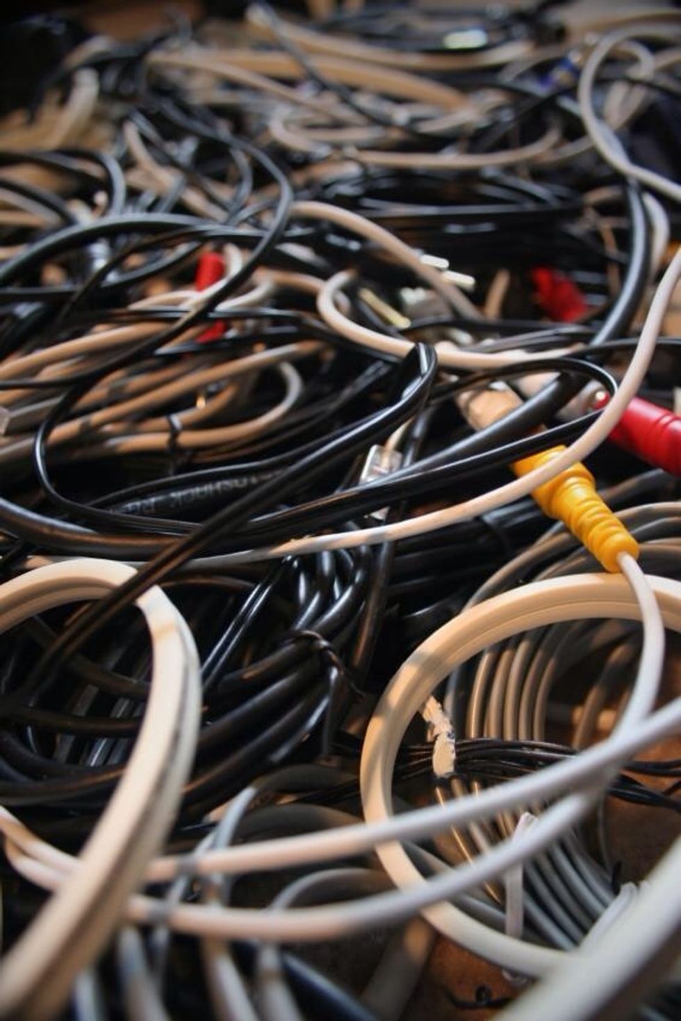 2) Find the end of one cable, unplug it, and weave it through the mess completely