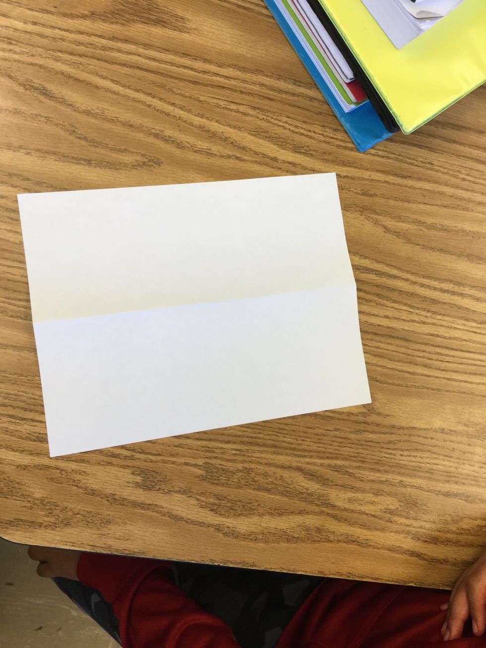 2. Fold paper in half 'hotdog style' and unfold.