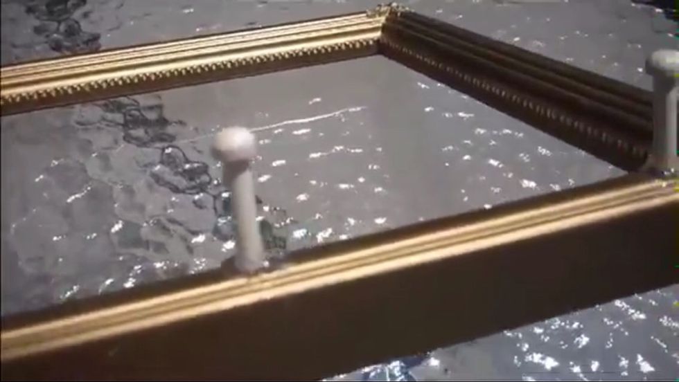 2) glue wooden pegs on whichever side you want the jewelry to hang from. The wooden pegs are on the longer side of my frame. Sorry for the blurry picture!