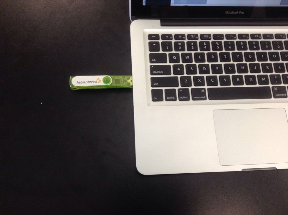 2. Insert the memory stick / USB into the side of the computer. Push it in