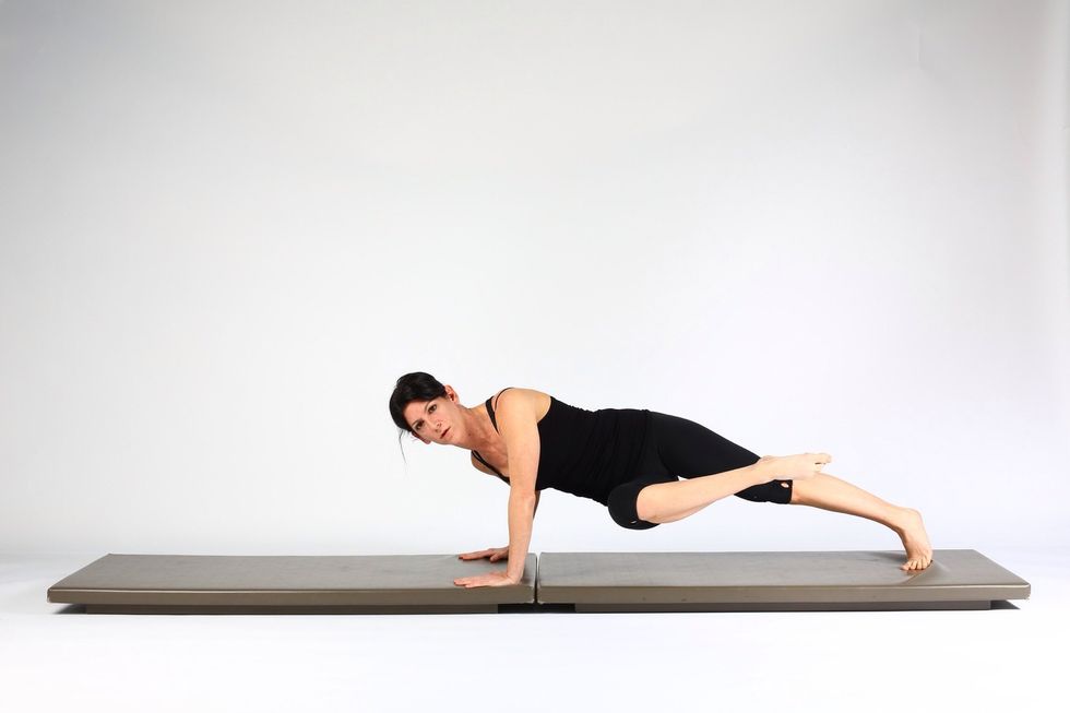 2. KNEE TO CHEST WITH ROTATION-  hold knee to chest position and turn hips and chest to one side (opposite elbow will flex)
