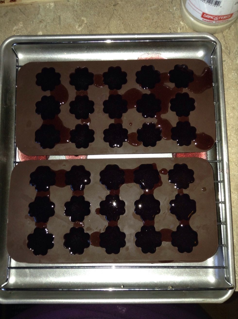2 layers of moulds separated by a cooling rack ready to go.   Refrigerate for 15-20 mins to set.