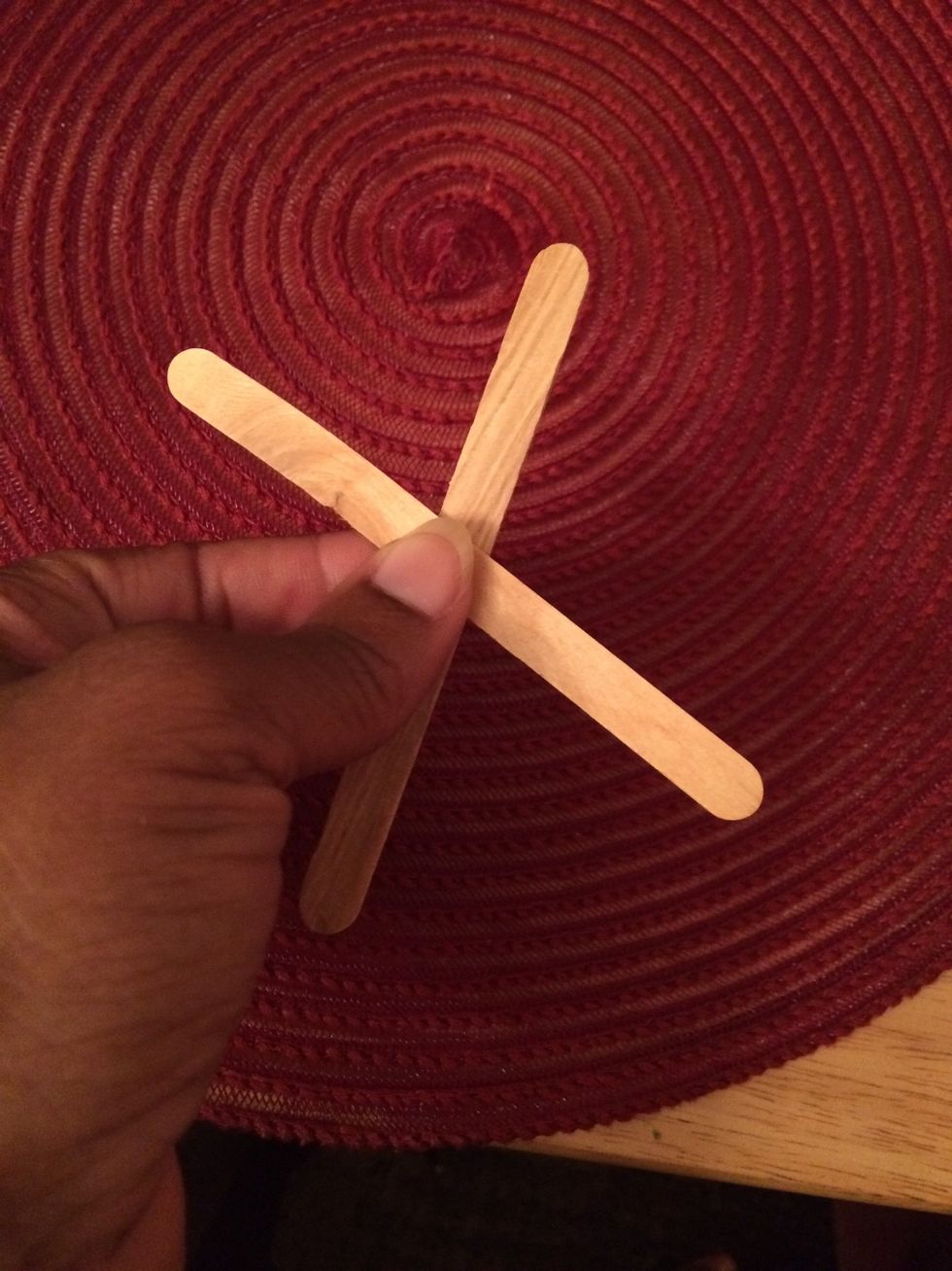 2. Make an x with your two Popsicle sticks.
