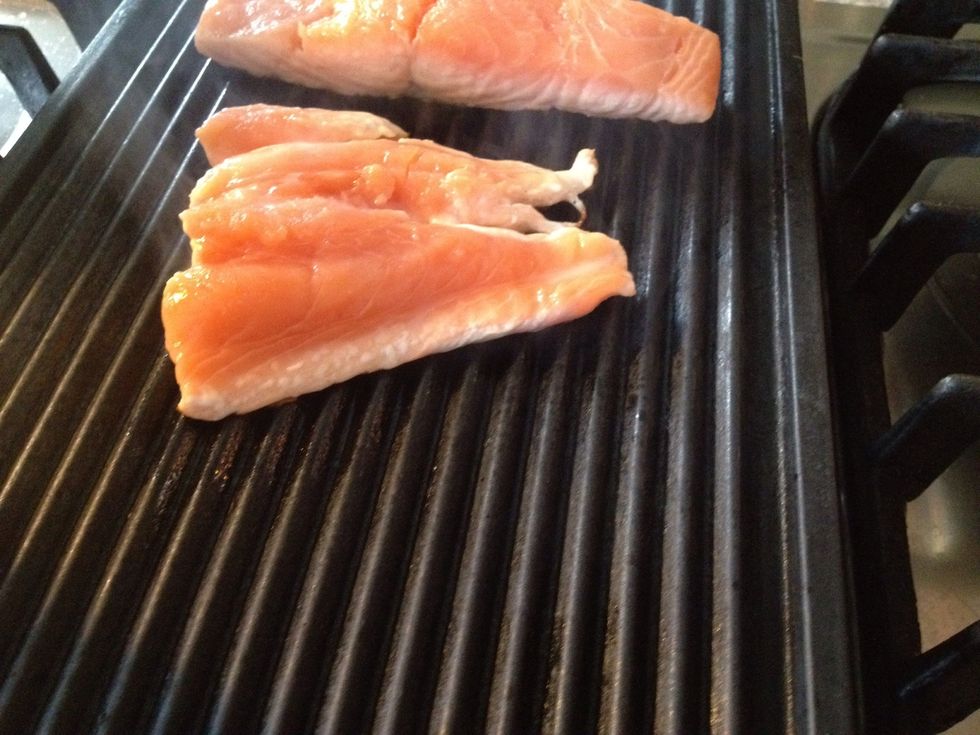 2 minutes of frying. No oil or butter just fish meets metal. If you try to turn them now they will stick to the grill or skillet. So wait