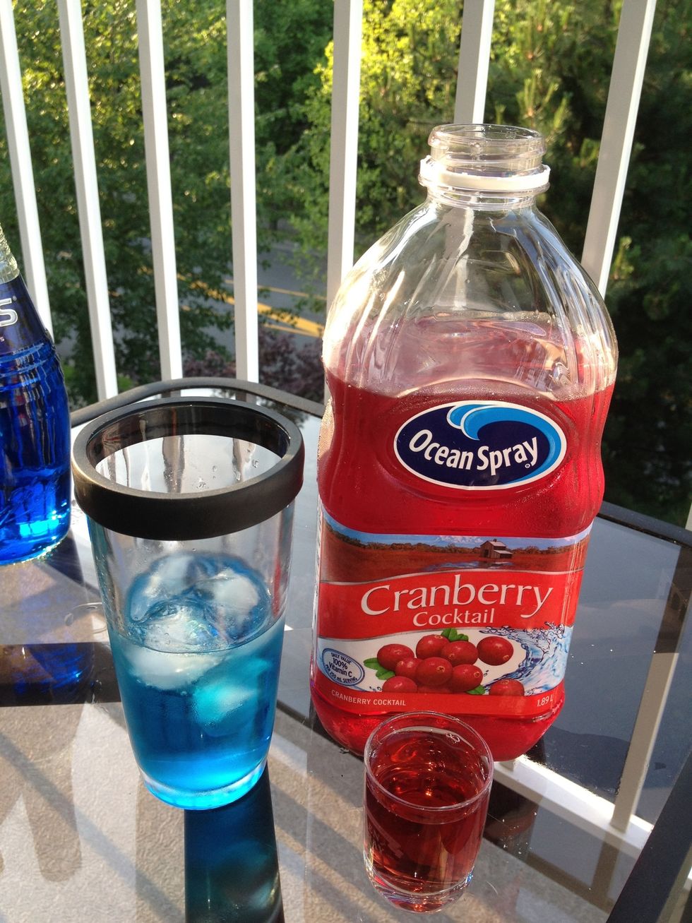 2 oz of Cranberry Cocktail..... Some say a splash for a true Martini.  I gotta go to work tomorrow. Plus it offsets the the taste of the Blue Bols . No pun intended.