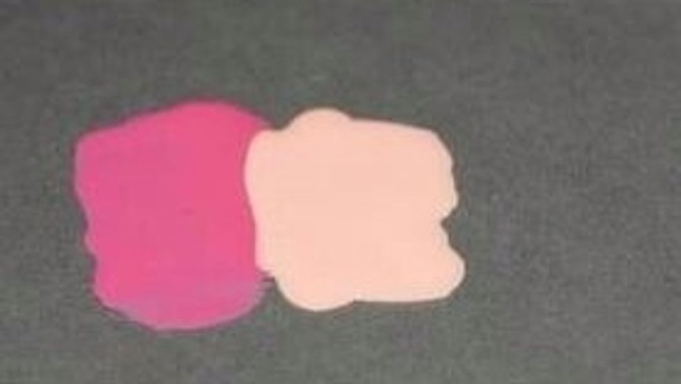 2. Paint on a reasonable amount of the two nail polishes you chose to use onto a flat surface, placing one color above (not on top) of the other.