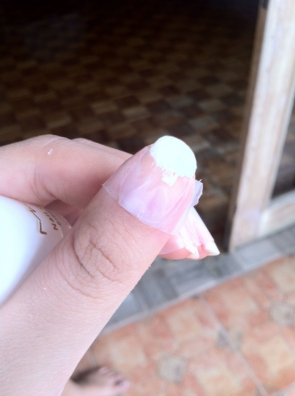 2: Put on the nail polish just on the tip of your nails and across the tape a little bit.