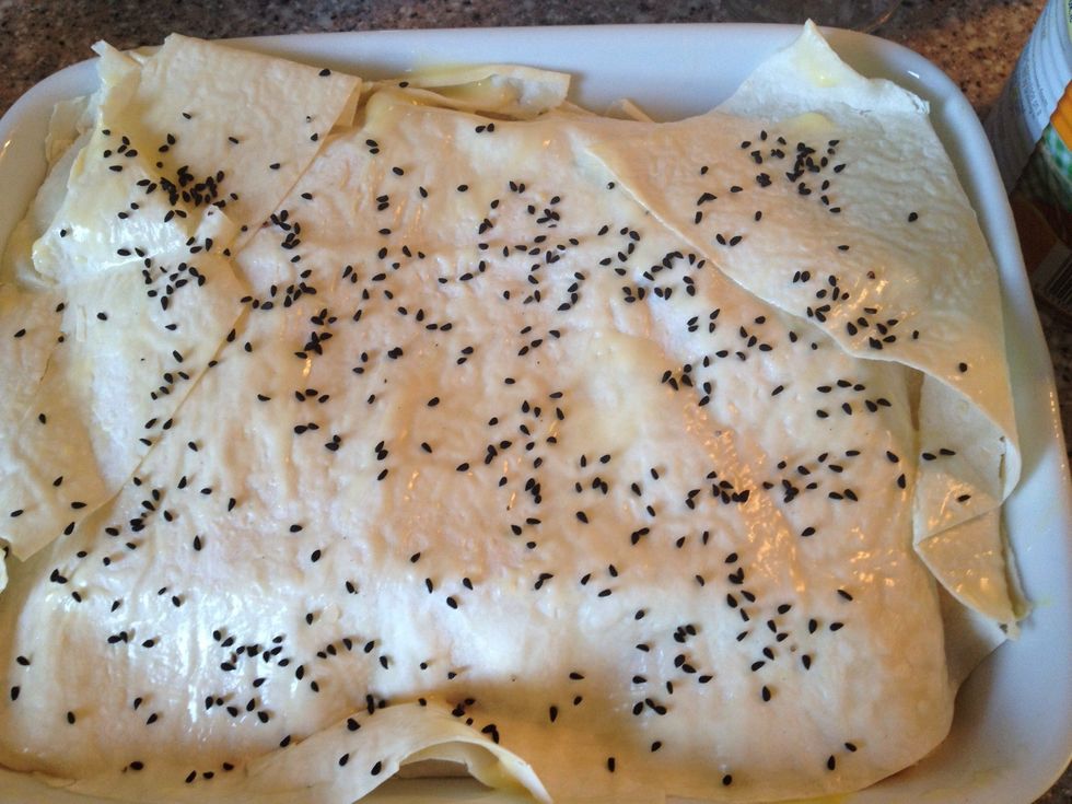 2 sheets of filo dough on top again brushed with melted butter on both sides. I had some nigella seeds so I sprinkled them on top just for the eye.