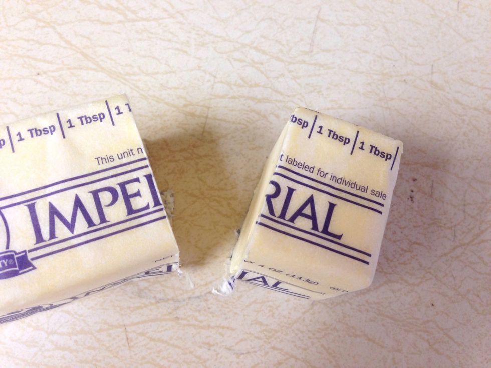 2 tablespoons of butter. (Max 2.5 tbs) We have to remain healthy!