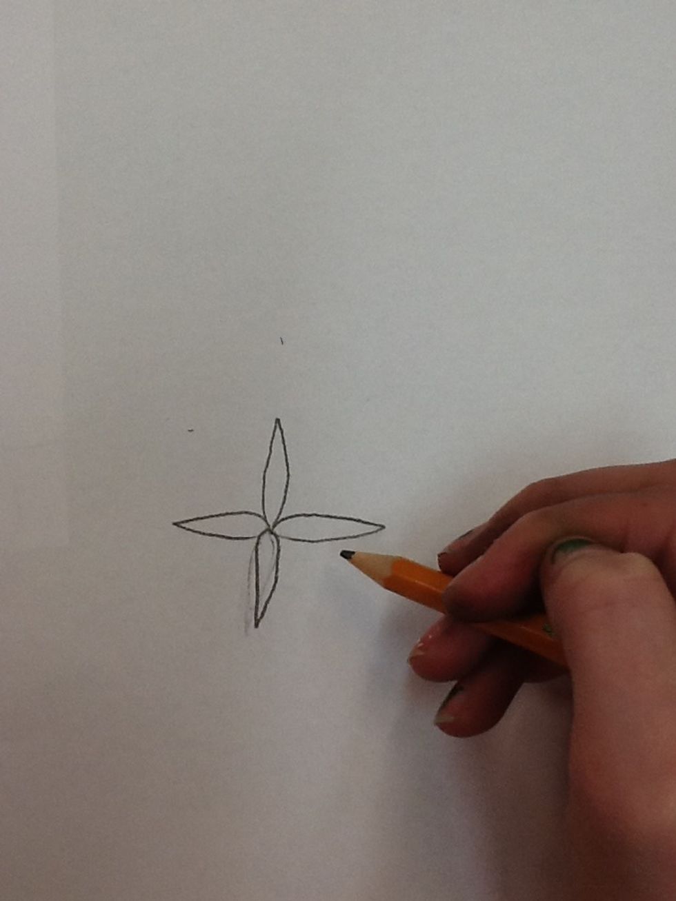 2) Then, you're going to pick up your pencil and draw 4 flower petals.