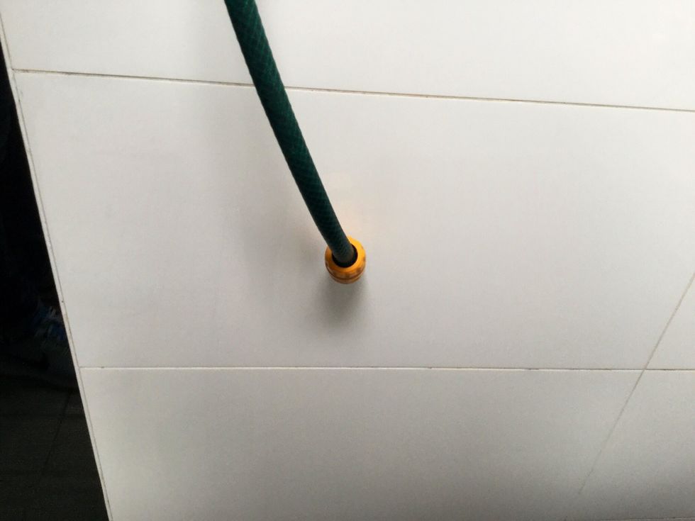 20 meter GARDEN HOSE AND CONNECTIONS. Cut hose into 2 pieces. Connect first hose piece to the first pump using the hose connection and lead the other end to 120 liter bucket