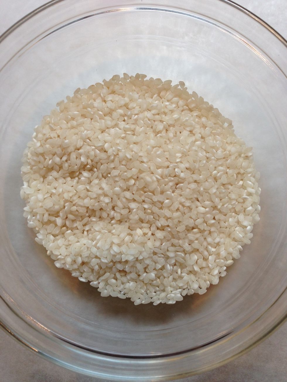 200 g round rice not washed. Keep all the starch. It will hold it together